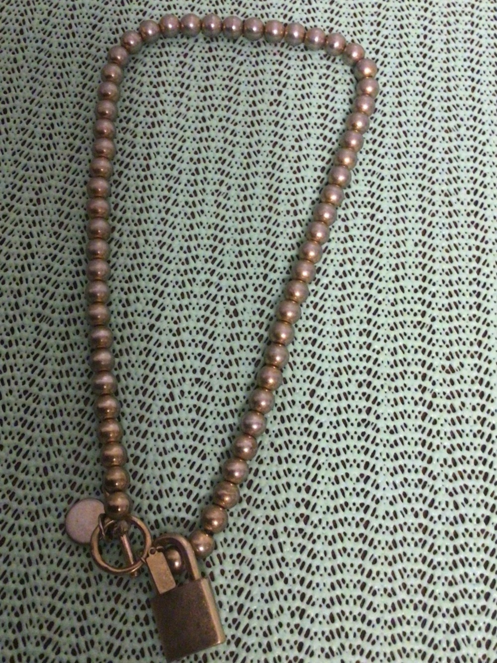 Bella. Canvas faux pearl necklace with lock pendant and Togo clap light gray